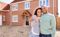 Couple young moving house conveyancing happy 1470584330