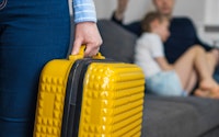 Divorce speration close up yellow suitcase 1360104137